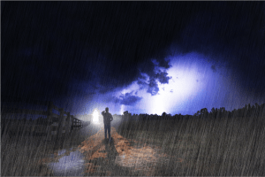 man in the rain walking towards the light